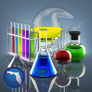 colorful chemicals in chemical laboratory vessels - with Florida icon