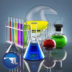 colorful chemicals in chemical laboratory vessels - with Maryland icon