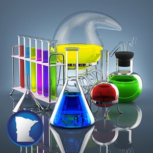 colorful chemicals in chemical laboratory vessels - with Minnesota icon