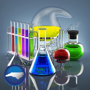 colorful chemicals in chemical laboratory vessels - with North Carolina icon