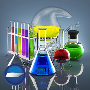 colorful chemicals in chemical laboratory vessels - with Tennessee icon