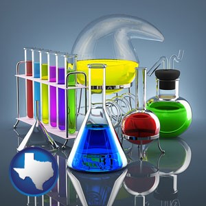 colorful chemicals in chemical laboratory vessels - with Texas icon