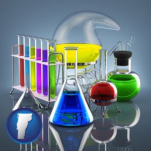 colorful chemicals in chemical laboratory vessels - with Vermont icon